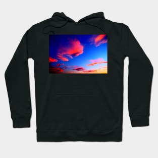 Plenty of bright pink clouds scattered on the yellow-blue sky Hoodie